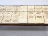 a coffee table with a tile design on it