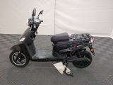 a scooter that is parked on a checkered floor