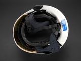 a close up of a helmet on a black surface