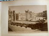 an old picture of a train on the tracks in the city