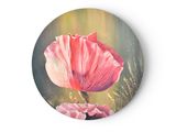 a painting of a pink flower on a round plate