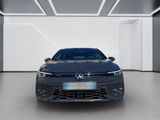 the front view of a blue volkswagen golf in a white room