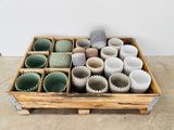 many cups in a wooden box on the floor