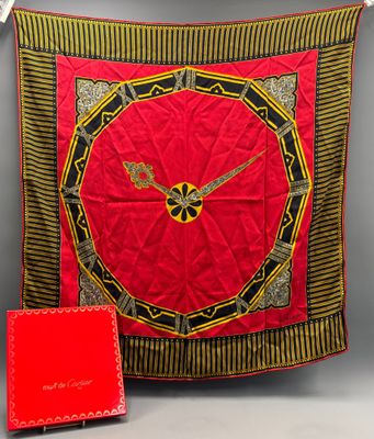 an image of a red and black clock on a red blanket