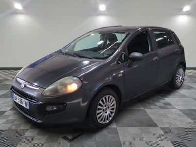 a picture of a small car parked in a garage