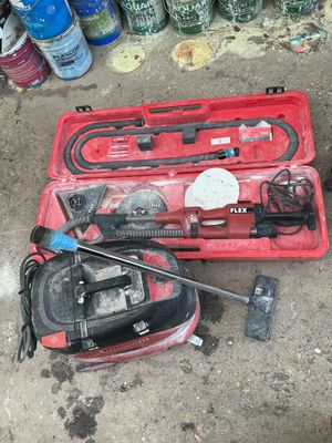 a red case with tools in it sitting on the ground