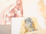 many drawings of a woman on a table