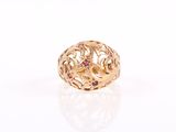 an image of a gold ring with pink stones on a white surface