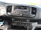 a car dashboard with a radio and a steering wheel
