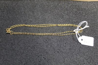 a close up of a gold chain with a tag on it