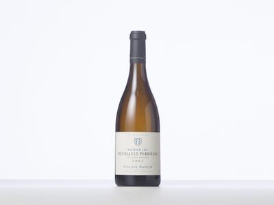 a bottle of white wine sitting on top of a table
