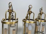 pair of antique brass lanterns with glass panels and brass fittings