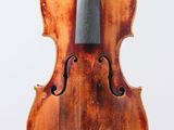 a close up of a violin on a white surface with a white background