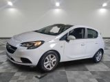 a picture of a white car parked in a garage