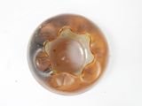a glass bowl with a brown substance inside of it