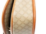 the inside of a brown and tan purse with a leather handle