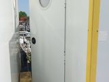 a white door with a hole in the side of it
