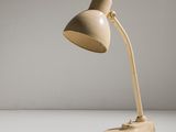a lamp that is sitting on a table in the room