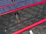 several ties are lined up on a red surface