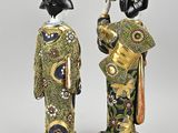 pair of japanese figurines of women in kimono robes