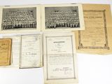 an old photo of a group of old papers on a table