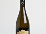 a bottle of wine that is sitting on a table