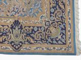 an image of a blue and gold rug with a floral design