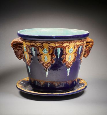 a purple and blue cup with a saucer on a saucer
