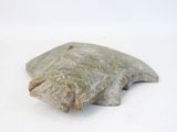 a stone object that is sitting on a white surface