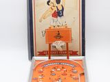 an orange pinball game set with a basketball game in it