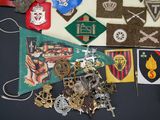 a lot of badges and other items on a table
