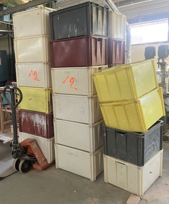 many boxes stacked on top of each other in a warehouse