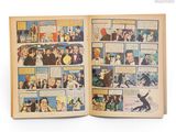 an open comic book with a picture of a group of people on it