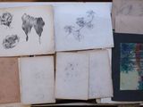 a pile of old books with drawings on them