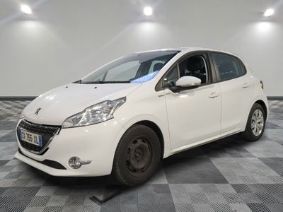 the small white car is parked in the room on the checkered floor