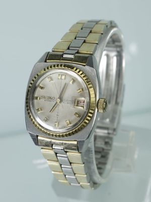 SEIKO: Montre bracelet de dame en acier et acier doré, guich…