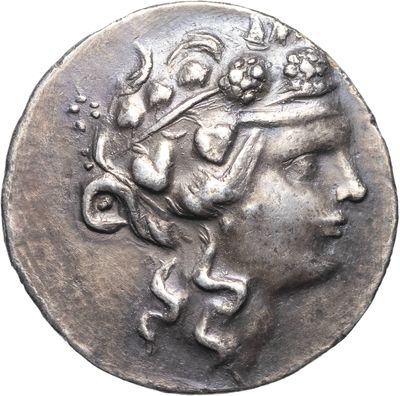 a close up of a coin with a woman ' s head on it