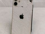 a close up of a broken iphone sitting on top of a table