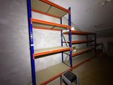 a room with shelves and a ladder in it