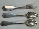 three silver spoons and a fork on a white surface