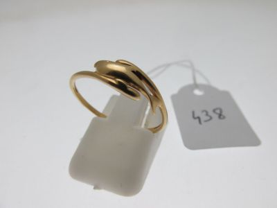 an image of a gold ring sitting on top of a white table