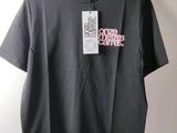 a black t - shirt with a pink logo on the front