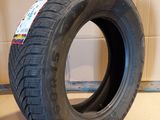 tire on the floor in front of a cardboard box and a cardboard box
