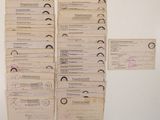 a lot of old papers that are on the wall