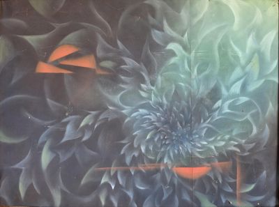a painting of a flower on the wall of a building