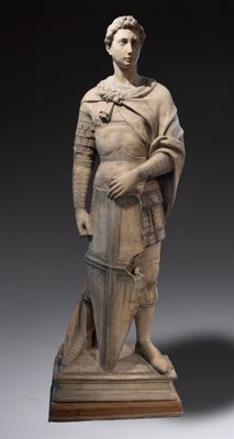 an image of a statue of a man holding a sword