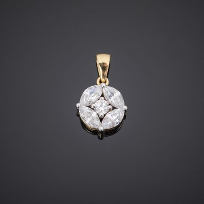 an 18k yellow gold and diamond pendant
