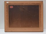 an old wooden picture frame with a red heart on it