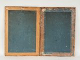 two wooden frames that are open on a white surface