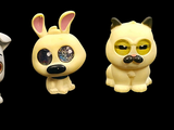 three toy dogs that are sitting next to each other